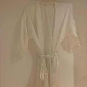 Short white robe with lace detail